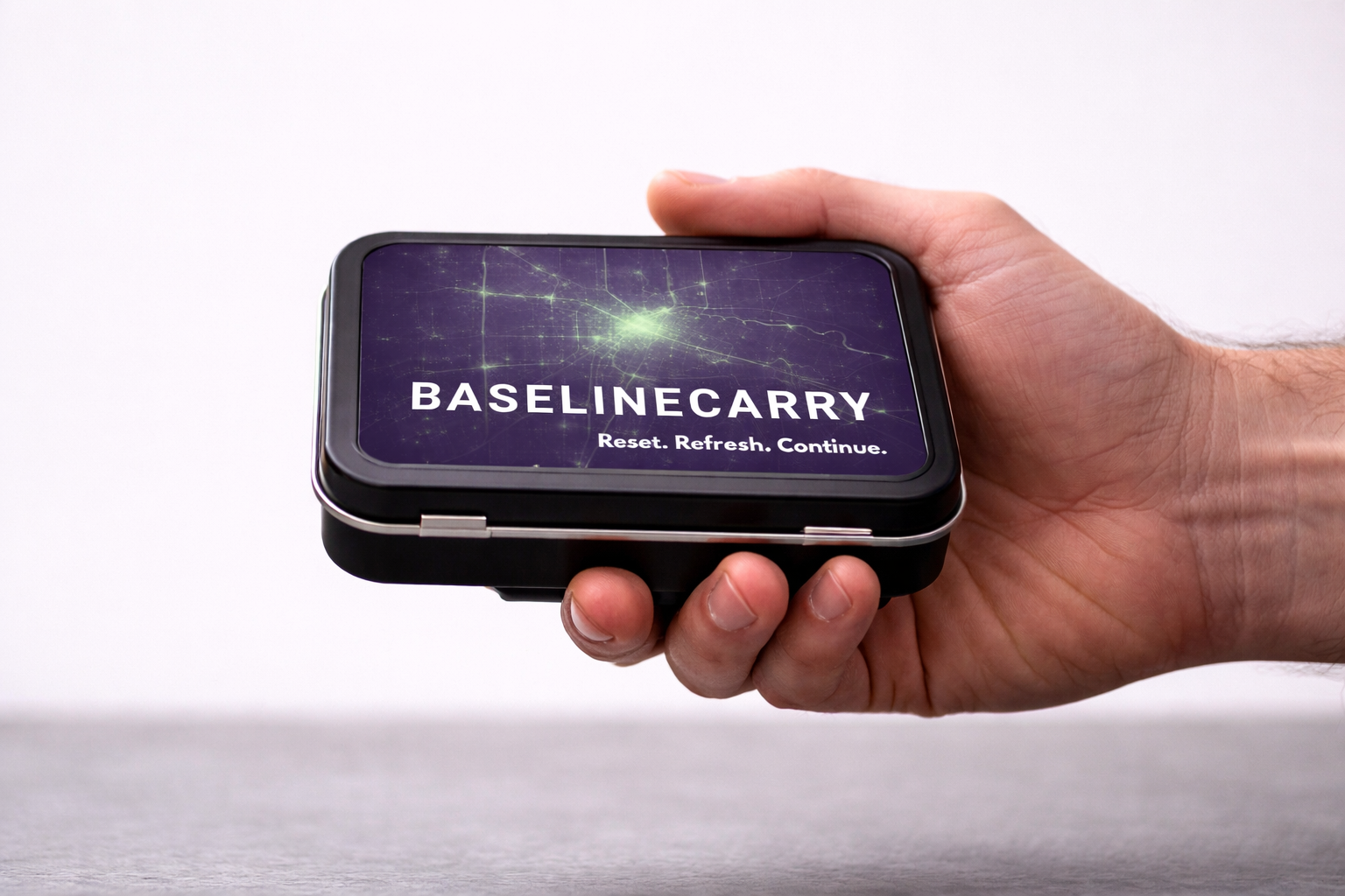 BaselineCarry Pocket Reset Tin shown in hand for scale.